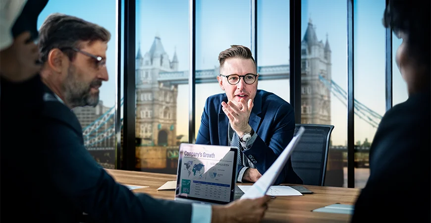 Tax advisors in London reviewing UK tax reports and compliance documents