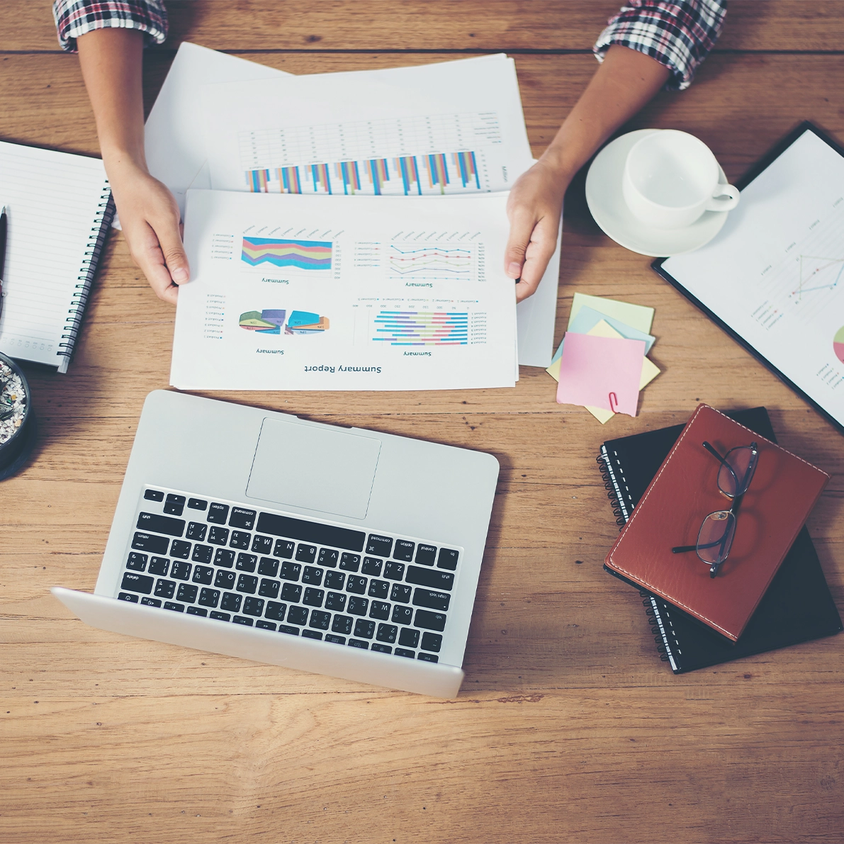 UK business owner reviewing monthly cash flow forecast and budget vs actuals on a laptop